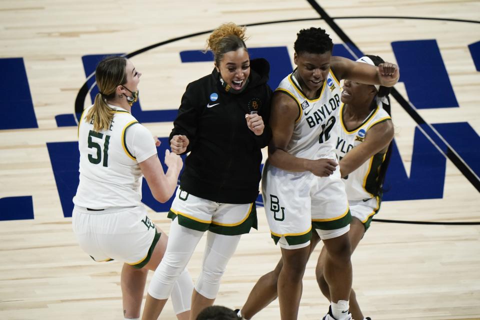 Baylor players celebrate after an NCAA college basketball game against Michigan in the Sweet 16 round of the Women's NCAA tournament Saturday, March 27, 2021, at the Alamodome in San Antonio. Baylor won 78-75 in overtime. (AP Photo/Morry Gash)