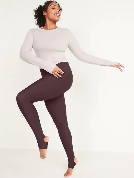 <p>These purple <span>Old Navy Extra High-Waisted PowerSoft Stirrup Leggings in Plum Wine</span> ($30, originally $45) would look pretty with blush-colored tops, too.</p>