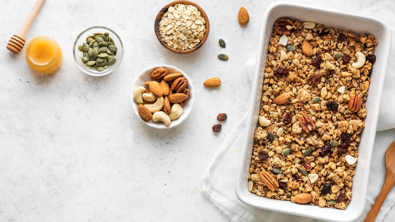 prepping granola to bake