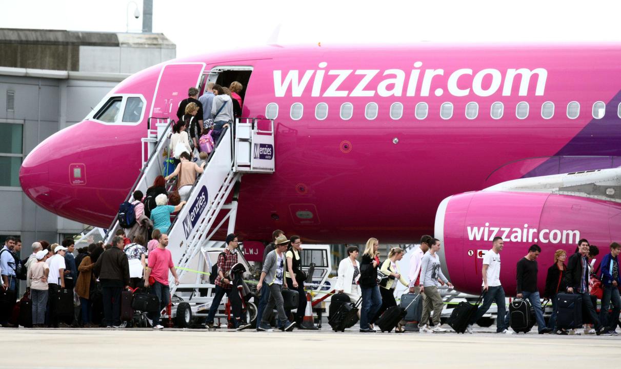 File photo dated 20/07/11 of passengers getting on a Wizz Air plane at Luton Airport. Flight prices between the UK and the Middle East could be slashed to a quarter of current levels once Wizz Air receives new aircraft, the airline has claimed. Marion Geoffroy, UK managing director of Wizz Air, predicted Airbus’ A321XLR planes will 