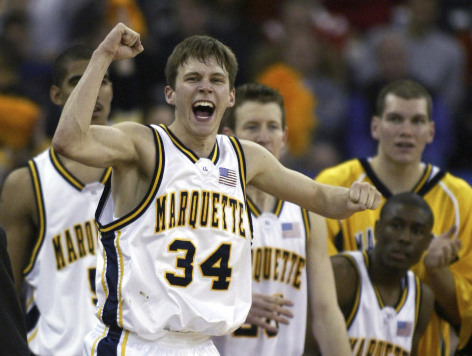 FILE - Marquette's Travis Diener (34) celebrates his team's 101-92 win over Missouri, Saturday, March 22, 2003, in the second round of the NCAA Midwest Regional in Indianapolis. Diener scored 26 points in the win. (AP Photo/Michael Conroy, File)