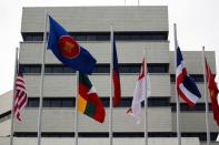 FILE PHOTO: Flags outside ASEAN secretariat building ahead of the summit in Jakarta