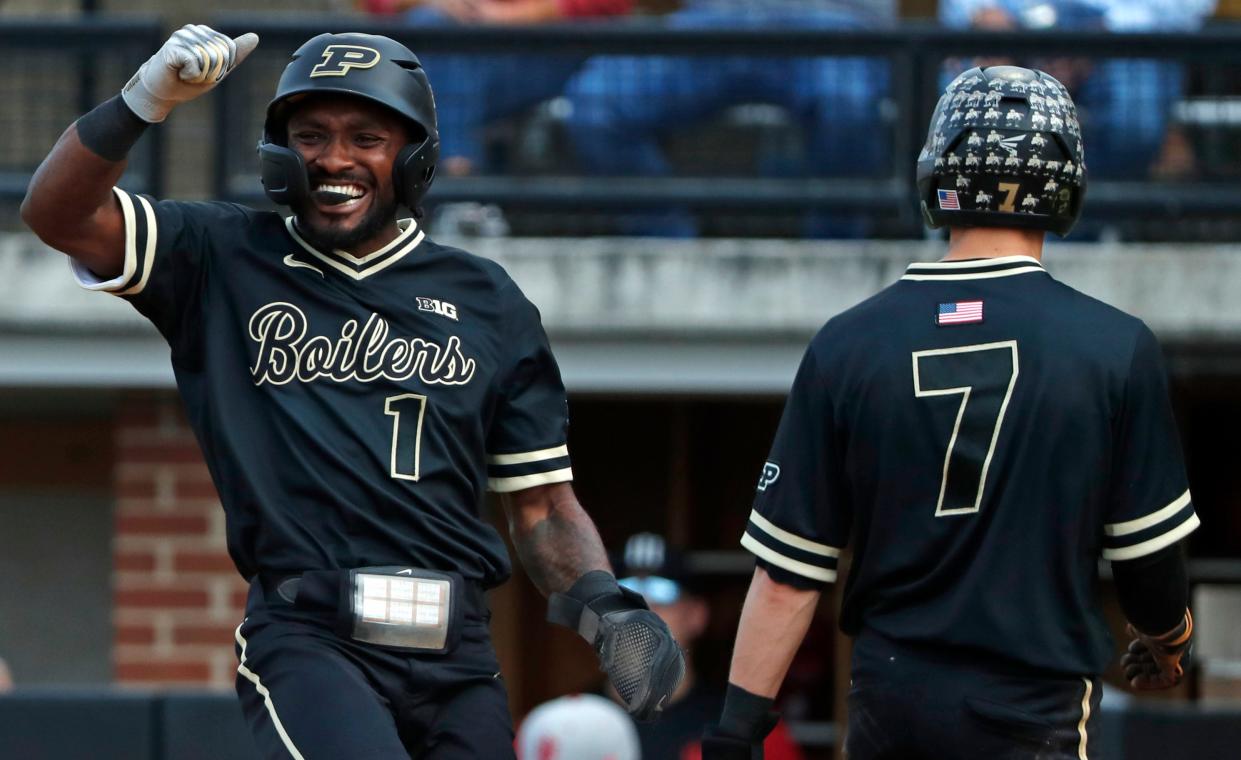 Purdue Boilermakers outfielder Mike Bolton Jr. (1) celebrates after Purdue Boilermakers infielder Camden Gasser (7) scores during the NCAA baseball game against the Indiana Hoosiers, Friday, May 3, 2024, at Alexander Field in West Lafayette, Ind. Purdue won 7-4.