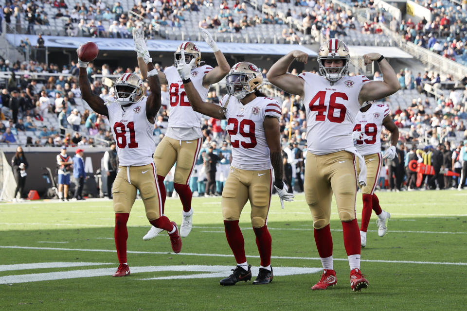 San Francisco 49ers wide receiver Trent Sherfield (81) celebrates with teammates including Ross Dwelley (82), Talanoa Hufanga (29) and Taybor Pepper (46) after recovering a fumble punt by the Jacksonville Jaguars during the second half of an NFL football game, Sunday, Nov. 21, 2021, in Jacksonville, Fla. (AP Photo/Matt Stamey)