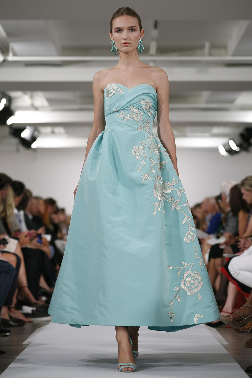 The Oscar de la Renta Spring 2014 collection is modeled during Fashion Week in New York, Tuesday, Sept. 10, 2013. (AP Photo/John Minchillo)