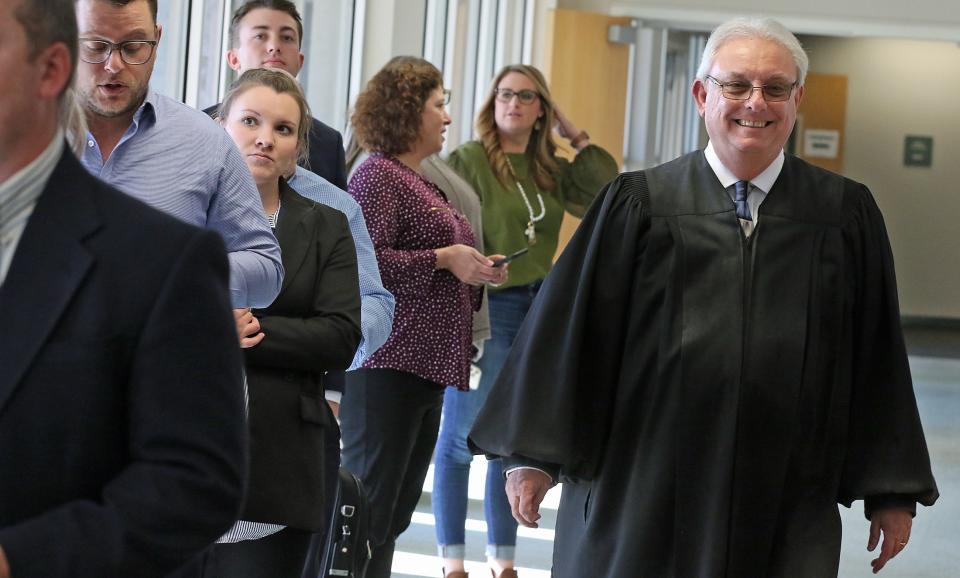 Judge Mike Lands greets people in line prior to his retirement event held Friday afternoon, Dec. 16, 2022, at the Gaston County Courthouse.