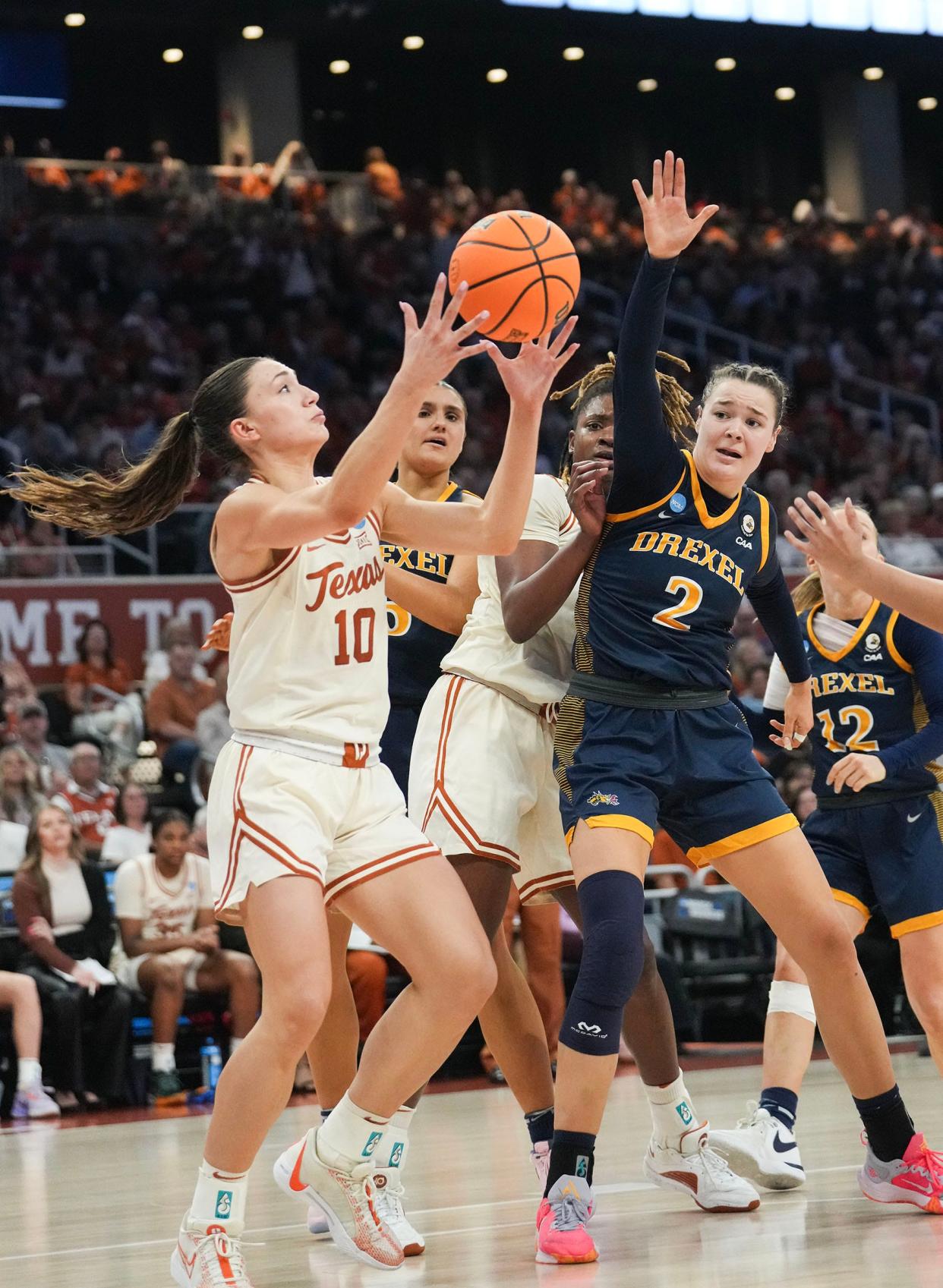 Texas guard Shay Holle retrieves a rebound during Friday's 82-42 win over Drexel in the NCAA Tournament. The top-seeded Longhorns will play eighth-seeded Alabama in Sunday's second round.