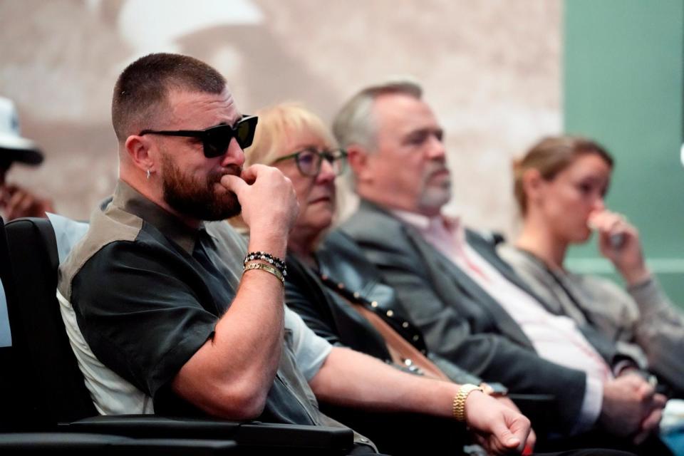 PHOTO: Philadelphia Eagles' Jason Kelce's family, from left, Kansas City Chiefs' Travis, mother, Donna, father, Ed, and wife, Kylie, listens as Jason Kelce announces his retirement at an NFL football press conference in Philadelphia, March 4, 2024.  (Matt Rourke/AP)