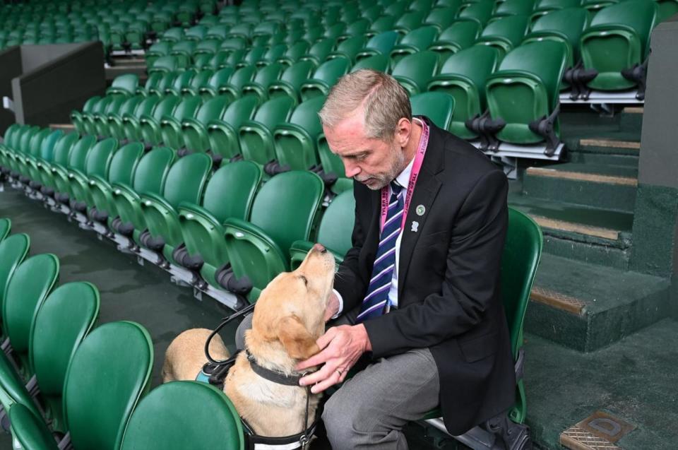 PHOTO: Flo and owner Mark Millsand together in the stands on Centre Court at Wimbledon on Sunday, July 7, 2024. (ABC News)