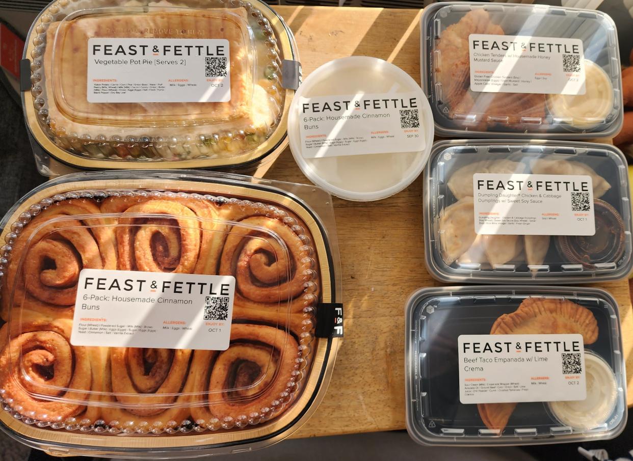 A lineup of Feast and Fettle foods might include their cinnamon buns, appetizers and main course dishes.