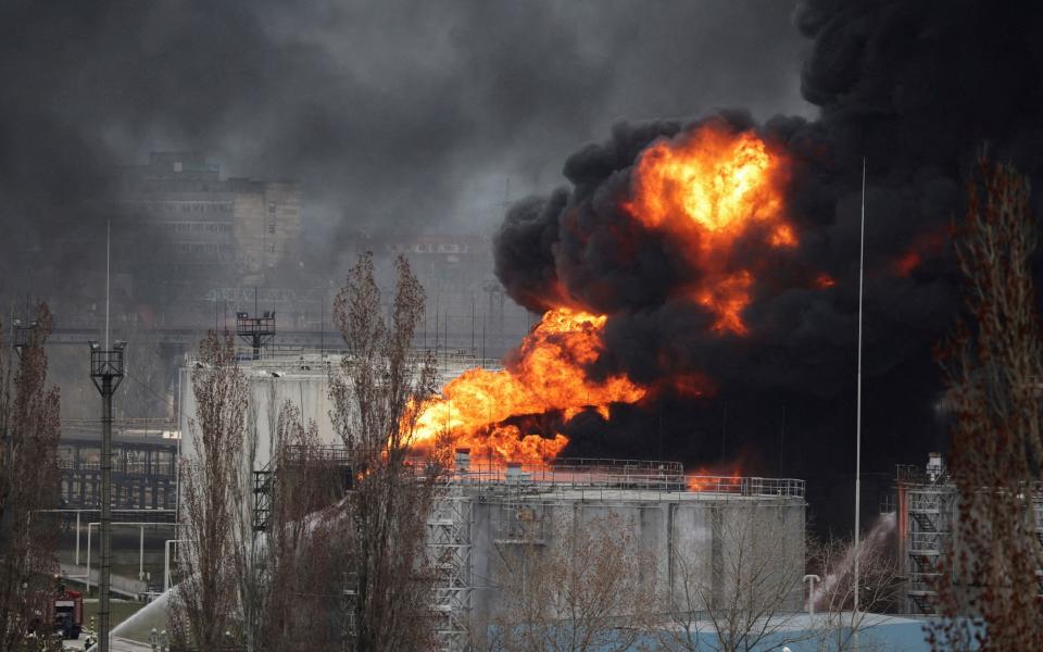 FILE PHOTO: Firefighters operate at an oil refinery which caught fire following a missile attack near the port city of Odesa, amid the ongoing Russia's invasion, in Ukraine, April 3, 2022. REUTERS/Nacho Doce/File Photo - REUTERS/Nacho Doce/File Photo