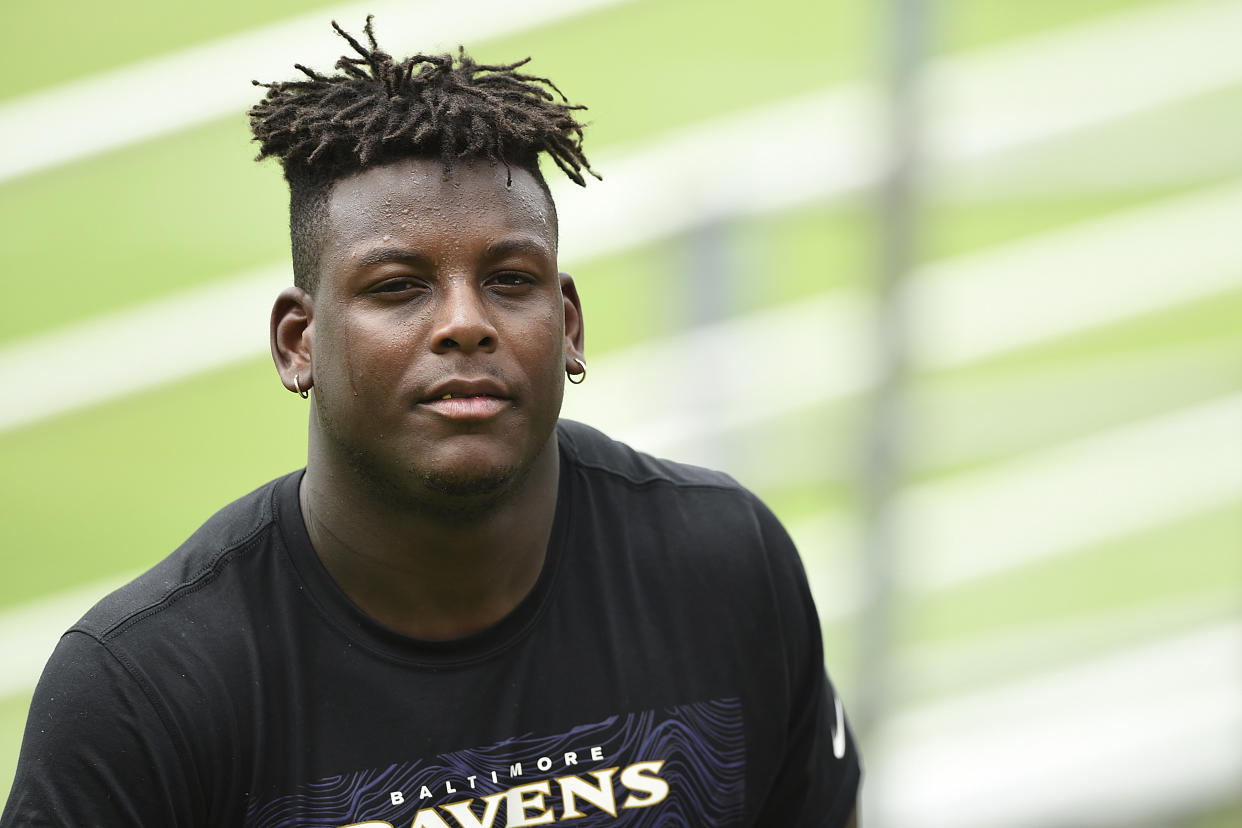 Baltimore Ravens rookie linebacker Jaylon Ferguson walks off the field after an NFL Football rookie camp, Saturday, May 4, 2019 in Owings Mills, Md. (AP Photo/Gail Burton)