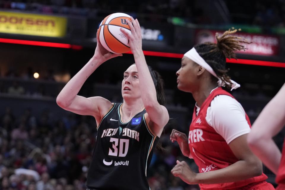 New York Liberty's Breanna Stewart (30) shoots past Indiana Fever's NaLyssa Smith during the first half of a WNBA basketball game, Saturday, July 6, 2024, in Indianapolis. (AP Photo/Darron Cummings)