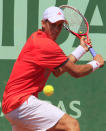 Canada's Vasek Pospisil hits a return to France's Edouard Roger-Vasselin during their Men's Singles 1st Round tennis match of the French Open tennis tournament at the Roland Garros stadium, on May 27, 2012 in Paris. AFP PHOTO / JACQUES DEMARTHONJACQUES DEMARTHON/AFP/GettyImages