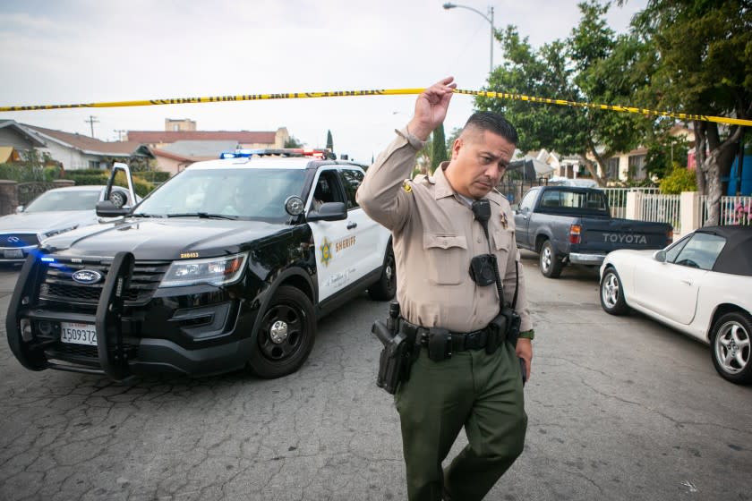EAST LOS ANGELES, CA - JUNE 28: Police work the crime scene where three children were found dead at a home on South Ferris Ave in East Los Angeles on Monday, June 28, 2021 in East Los Angeles, CA. (Jason Armond / Los Angeles Times)