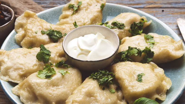 Pierogi served with sour cream