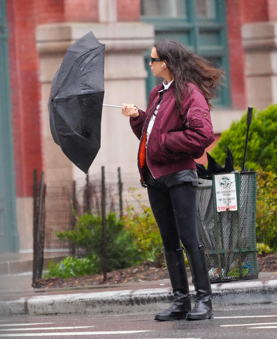 NEW YORK, NEW YORK - APRIL 03: Irina Shayk is seen with her umbrella getting blown by the wind on April 03, 2024 in New York City. (Photo by Gotham/GC Images)