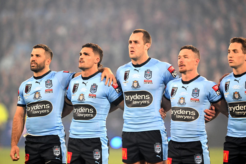 The New South Wales players lining up for the national anthem.