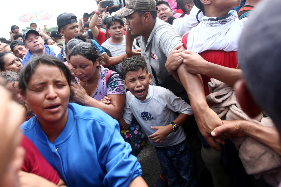 <p>A Honduran migrant, part of a caravan trying to reach the U.S., cries as the group storms a border checkpoint in Guatemala, in Ciudad Hidalgo, Mexico, Oct. 19, 2018. (Photo: Edgard Garrido/Reuters) </p>