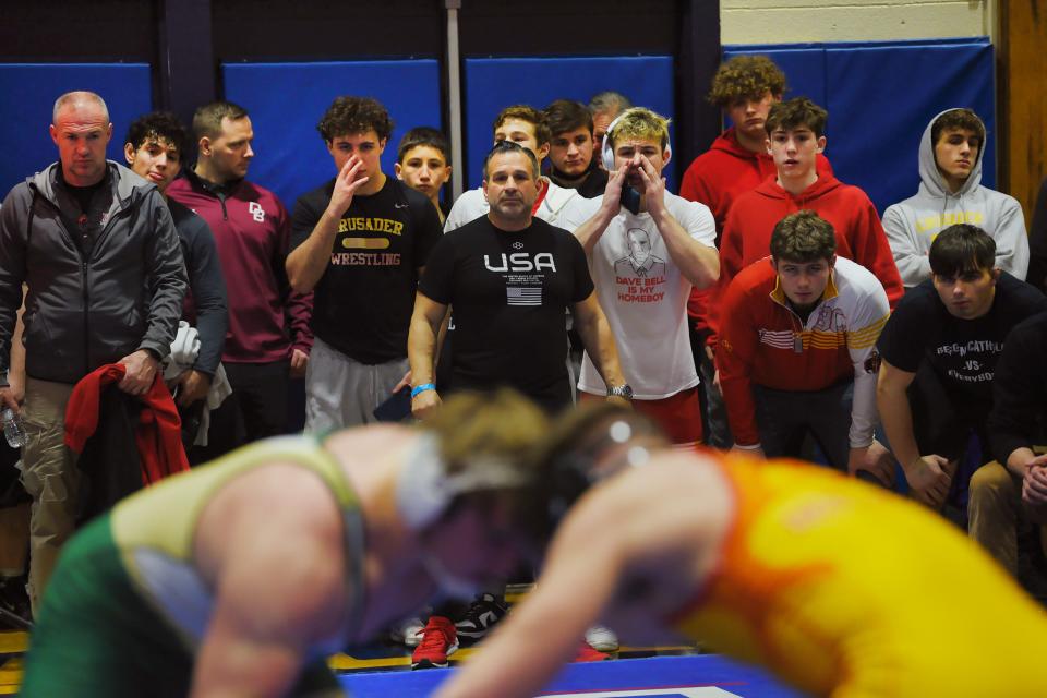 Coaches and teammates for Aj Fricchione of Bergen Catholic (shown Right foreground) as he fights against Aidan Schlett of St. Joseph Regional in the 215 pound match of their quarter final during the Bergen County Wrestling Tournament Day 2 at Hackensack High School in Hackensack on Sunday, January 23rd, 2022.  