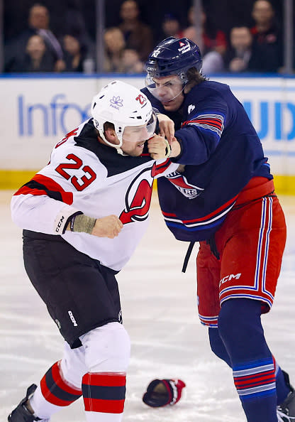 NEW YORK, NY – APRIL 03: New York Rangers Right Wing Matt Rempe (73) and New Jersey Devils Winger Kurtis MacDermid (23) fight before the opening face-off in the National Hockey League game between the New Jersey Devils and the New York Rangers on April 4, 2024 at Madison Square Garden in New York, NY. (Photo by Joshua Sarner/Icon Sportswire via Getty Images)