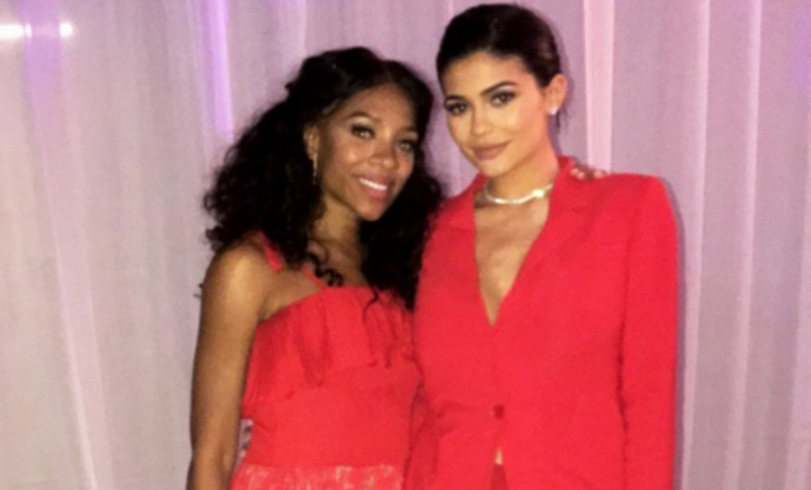 Kylie Jenner wears a red pantsuit for a summer wedding. (Lil Mama via Instagram)