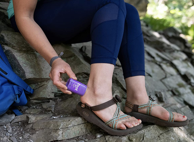 A model rubbing balm on their heel