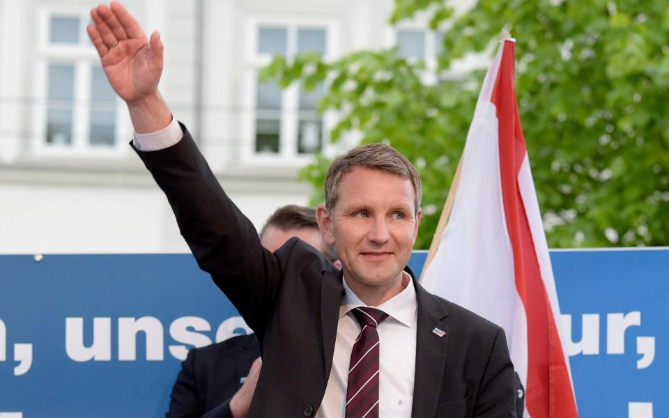 In this Wednesday, May 18, 2016 photo head of AfD in Thuringia, Bjoern Hoecke, smiles during a rally of the Alternative for Germany, AfD, party in Erfurt, eastern Germany. The German domestic intelligence agency is putting the far-right Alternative for Germany party under heightened scrutiny. (AP Photo/Jens Meyer, file) - Jens Meyer/AP