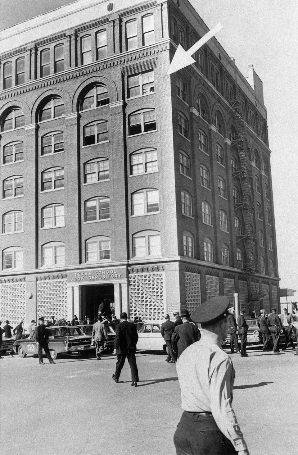 <p>An arrow points to the window where an assassin cut down President John F. Kennedy on Nov. 22, 1963, in Dallas. (Photo: Bettmann/Getty Images) </p>