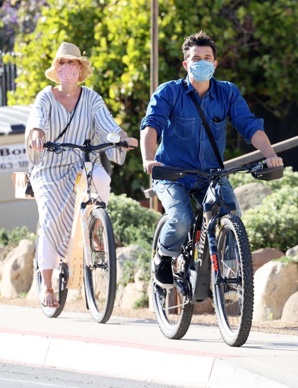 <p>Katy Perry and Orlando Bloom enjoy an afternoon bike ride together on Thursday in Santa Barbara. </p>