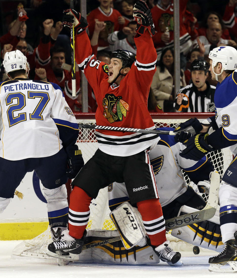 Chicago Blackhawks' Andrew Shaw (65) celebrates after scoring a goal during the second period in Game 4 of a first-round NHL hockey playoff series against the St. Louis Blues in Chicago, Wednesday, April 23, 2014. (AP Photo/Nam Y. Huh)