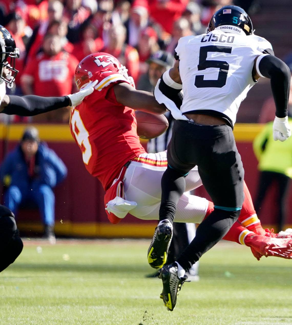 Chiefs wide receiver JuJu Smith-Schuster is driven to the turf after being hit hard by Jacksonville Jaguars safety Andre Cisco during Sunday’s game at GEHA Field at Arrowhead Stadium.