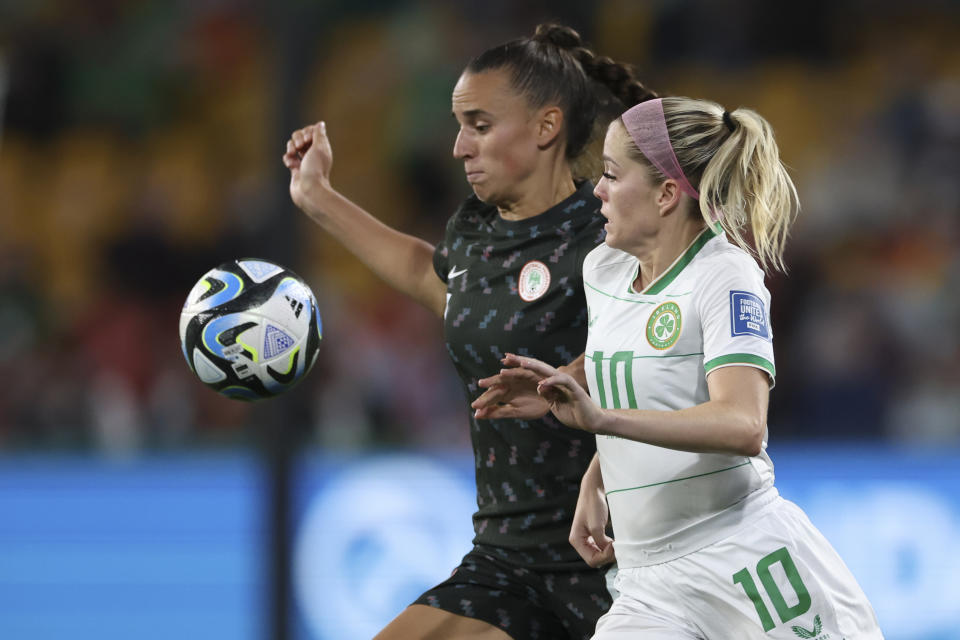 Nigeria's Ashleigh Plumptre, left, competes for the ball with Ireland's Denise O'Sullivan during the Women's World Cup Group B soccer match between Ireland and Nigeria in Brisbane, Australia, Monday, July 31, 2023. (AP Photo/Katie Tucker)