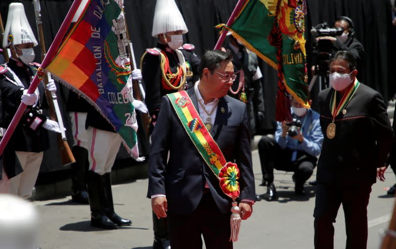 Bolivia's President Luis Arce and vice President David Choquehuanca walk after their swearing-in ceremony at the Plaza Murillo