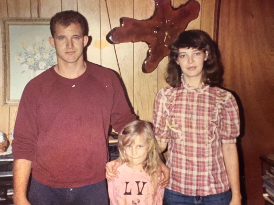 A young Adam Attebury stands with his sisters, Faith and Rachel.