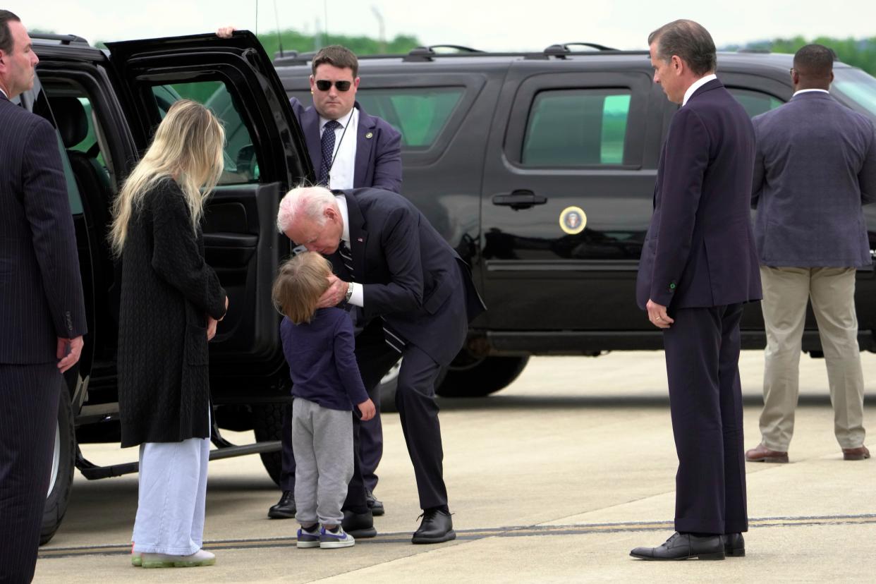 President Joe Biden greets his grandson Beau Biden as Hunter Biden and wife Melissa Cohen Biden watch, at Delaware Air National Guard Base in Delaware on Tuesday, June 11, 2024 (AP)