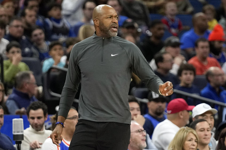 Orlando Magic head coach Jamahl Mosley shouts to players on the court during the first half of an NBA basketball game against the New York Knicks, Friday, Dec. 29, 2023, in Orlando, Fla. (AP Photo/John Raoux)