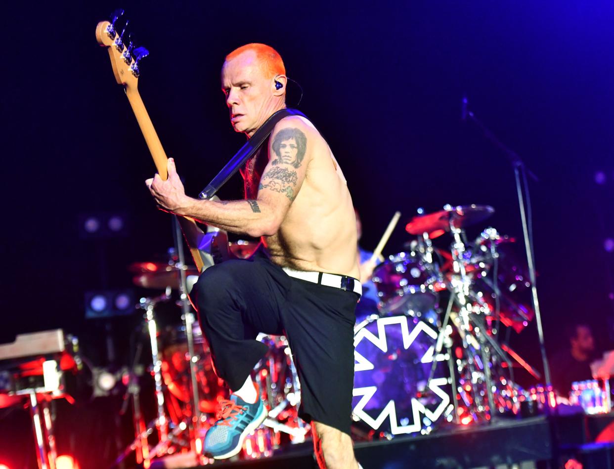 Red Hot Chili Peppers bassist Flea, seen here performing with the band in January, took a break from touring last weekend to get married to designer Melody Ehsani.