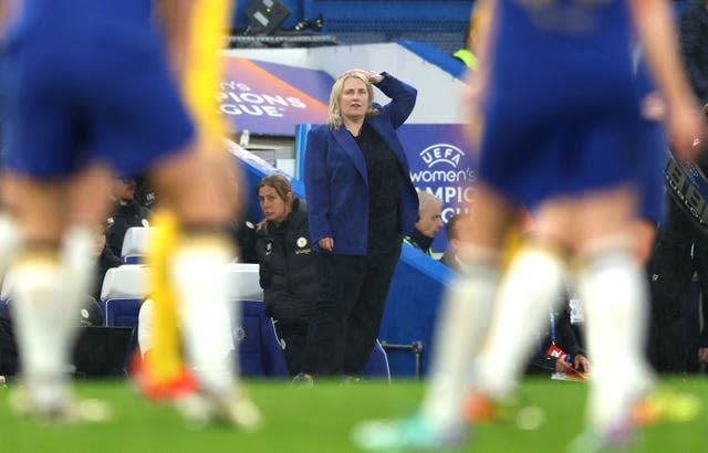 Emma Hayes, centre, seen between unidentified players, during Chelsea's Women’s Champions League semi-final second leg against Barcelona last season