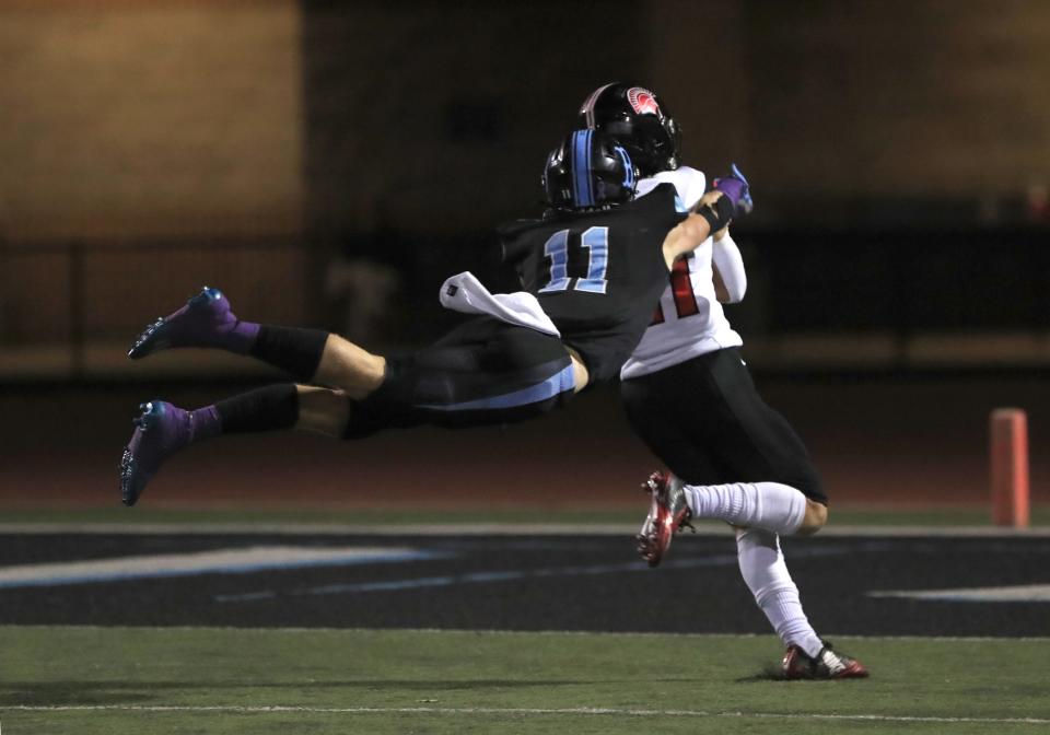 Buena's Colin Guenther makes a last-ditch effort to stop Rio Mesa's Henry Borjas as he heads for the end zone to score the Spartans' first touchdown during the second quarter of their Channel League game on Friday, Sept. 30, 2022, at Buena High. Rio Mesa won 14-13.