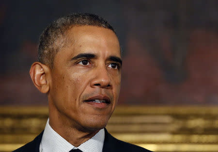 U.S. President Barack Obama talks about the vote on Capitol Hill about his request to arm and train Syrian rebels in the fight against the Islamic State while in the State Dining Room at the White House in Washington, September 18, 2014. REUTERS/Larry Downing