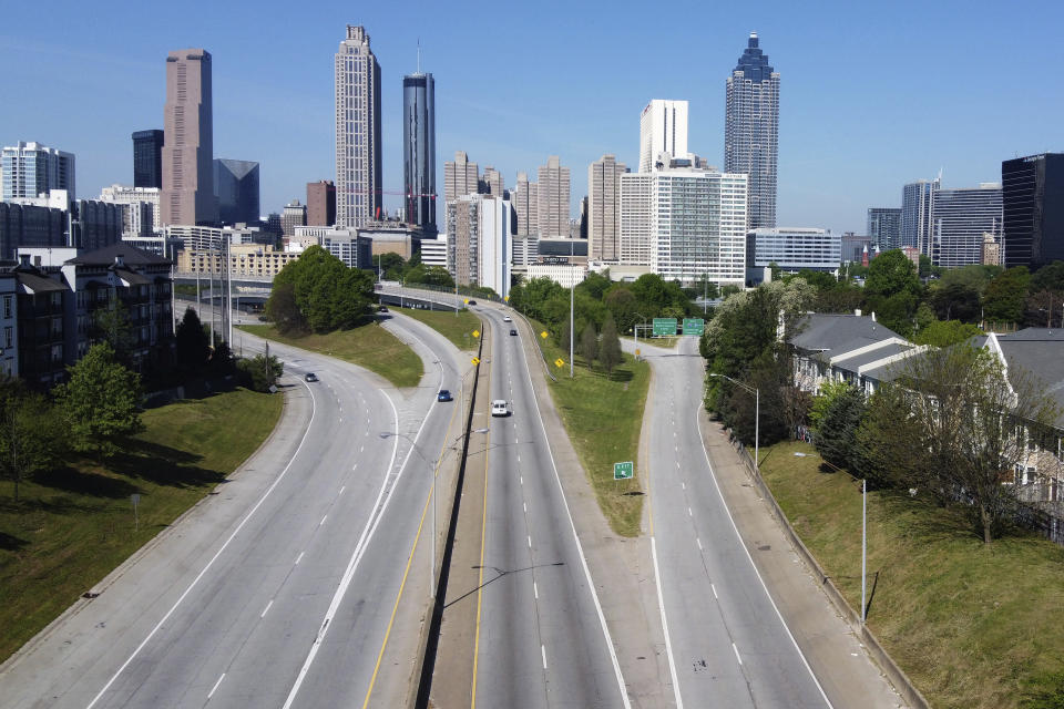 Lighter than normal traffic flow in and out downtown Atlanta Monday, April 6, 2020. Gov. Brian Kemp has issued an order to shelter in place in hopes of slowing the spread of the coronavirus. (AP Photo/John Bazemore)