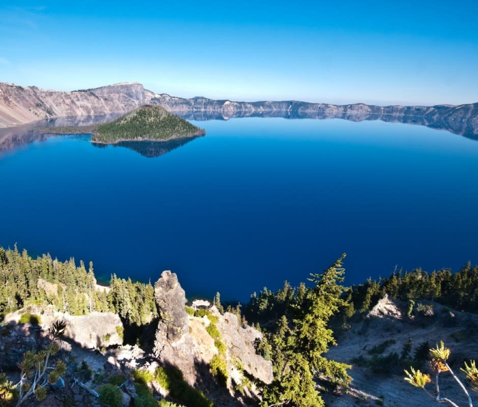 <p>Jeff Goulden</p><p>If you find yourself in Southern Oregon—a good place to find yourself—enlist in one of Main Street's daily seven-hour tours to Crater Lake National Park. Led by professional naturalists, your expedition to the Jewel of the Cascades touches on everything from the geological to the sublime. </p><p>The landscapes here are nothing short of surreal—courtesy of the eruption of Mt. Mazama 7,700 years ago, when the mountain collapsed and left a nearly 2,000-foot deep crater in its place. Some seven millennia of rain and snowmelt have filled the crater since then, resulting in one of the clearest bodies of water on the planet. </p><p>The park itself sprawls out over 183,224 acres of mountains, old growth forests, volcanic fumaroles, two waterfalls, and the lake—all over a range of elevations that provides diverse habitats for lots of animals. By the end of this tour, you'll be a Crater Lake expert, and will vow to return for a longer stay. </p><p>[From $169 per person; <a href="https://ashland-tours.com/crater-lake-adventure-tour/" rel="nofollow noopener" target="_blank" data-ylk="slk:ashland-tours.com;elm:context_link;itc:0;sec:content-canvas" class="link ">ashland-tours.com</a>]</p>