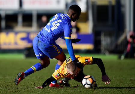 Soccer Football - FA Cup Third Round - Newport County AFC vs Leeds United - Rodney Parade, Newport, Britain - January 7, 2018 Leeds United's Hadi Sacko fouls Newport County's Dan Butler REUTERS/Rebecca Naden