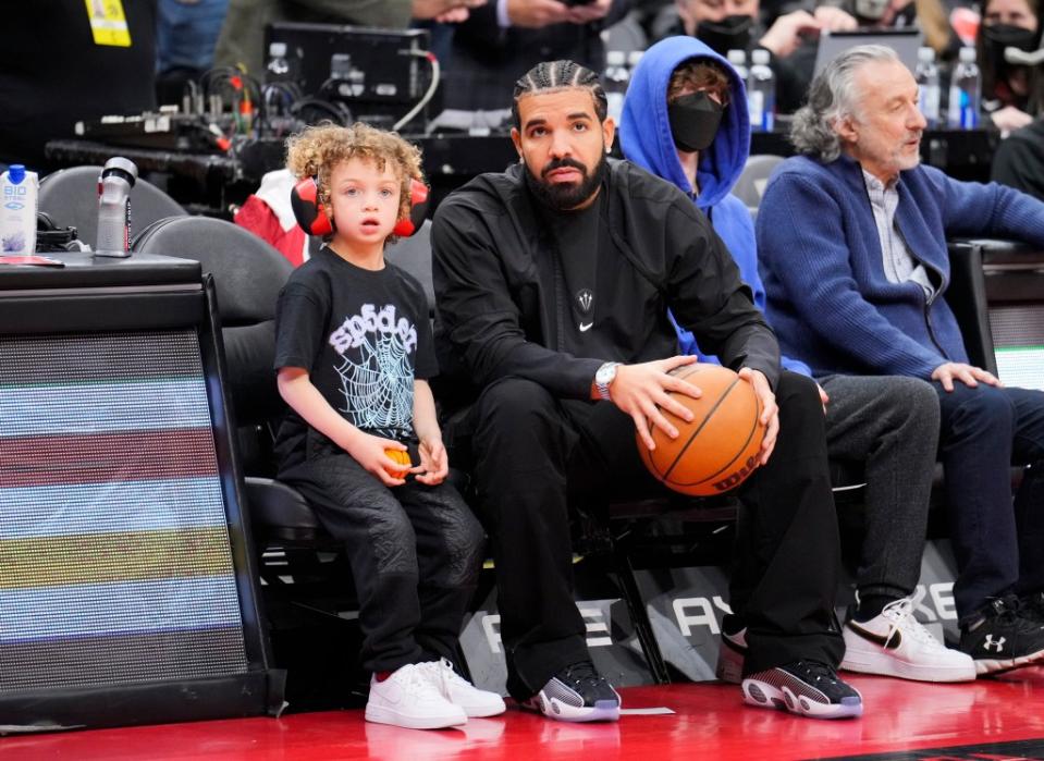 Drake with his secret son, Adonis. Getty Images