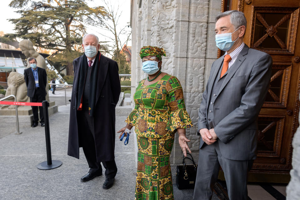 New Director-General of the World Trade Organisation Ngozi Okonjo-Iweala, center, speaks between WTO Deputy Directors-General Alan Wolff, left, and Karl Brauner upon her arrival at the WTO headquarters to takes office in Geneva, Switzerland, Monday, March 1, 2021. Nigeria's Ngozi Okonjo-Iweala takes the reins of the WTO amid hope she will infuse the beleaguered body with fresh momentum to address towering challenges and a pandemic-fuelled global economic crisis. (Fabrice Coffrini/Pool/Keystone via AP)