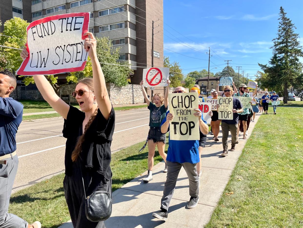 University of Wisconsin-Oshkosh students and staff rallied Tuesday, Oct. 3, against budget cuts that will eliminate more than 200 jobs.