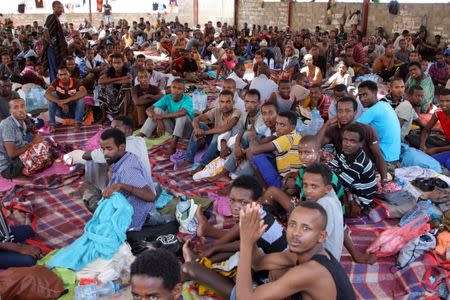 African migrants sit in a deportation center in Aden, Yemen March 17, 2018. Picture taken March 17, 2018. REUTERS/Fawaz Salman