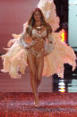 Bundchen stomped down the runway in a gold, bedazzled bikini and feathers for wings at the Victoria's Secret Fashion Show.