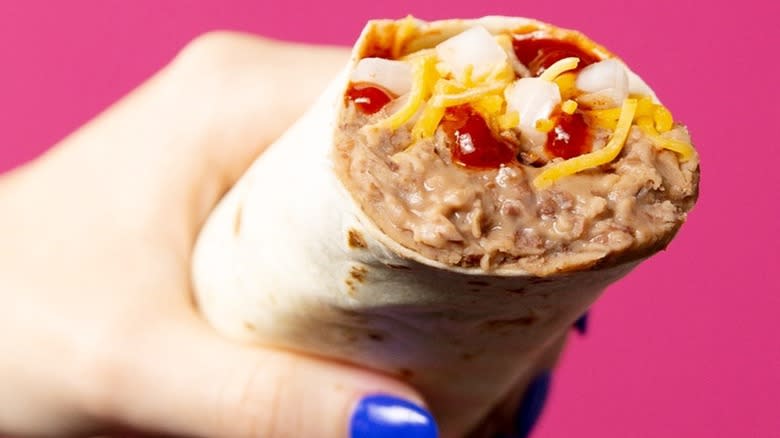 Hand holding a Bean Burrito